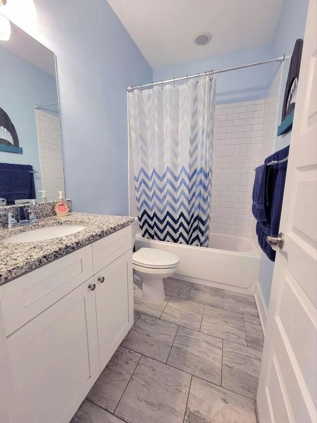1021 Tulip Dr, Ashland City, TN 37015 - full bathroom featuring marble look tile flooring, vanity, and shower / tub combo with curtain
