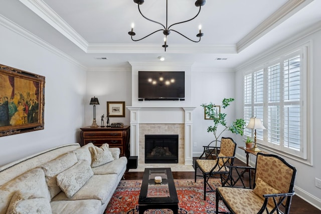 9020 Wenlock Ln, Franklin, TN 37064 - living area with wood finished floors, a chandelier, ornamental molding, a brick fireplace, and a tray ceiling