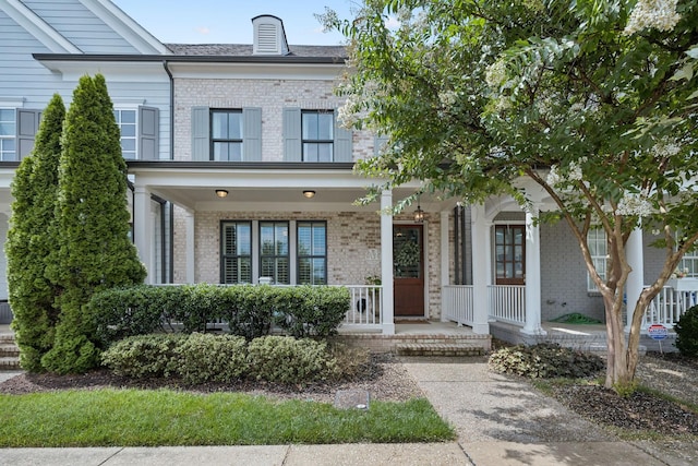 9020 Wenlock Ln, Franklin, TN 37064 - view of front of house featuring brick siding and covered porch