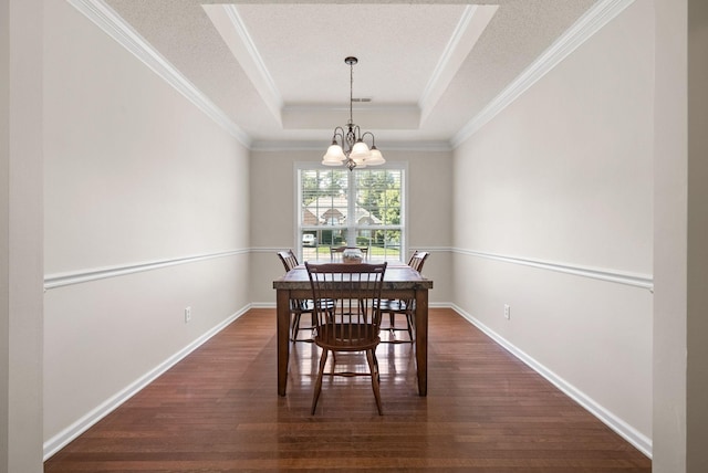 4328 Monticello Trce, Adams, TN 37010 - dining room with a chandelier, ornamental molding, a tray ceiling, dark wood finished floors, and a textured ceiling