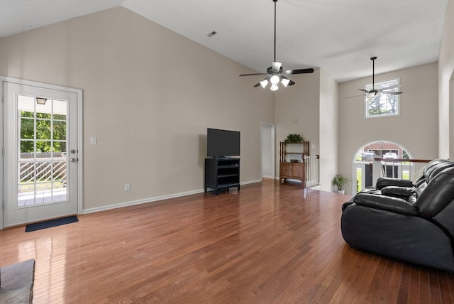 4328 Monticello Trce, Adams, TN 37010 - living room featuring high vaulted ceiling, a ceiling fan, wood finished floors, and healthy amount of natural light