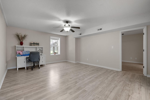 4328 Monticello Trce, Adams, TN 37010 - office space featuring a ceiling fan, light wood finished floors, and a textured ceiling