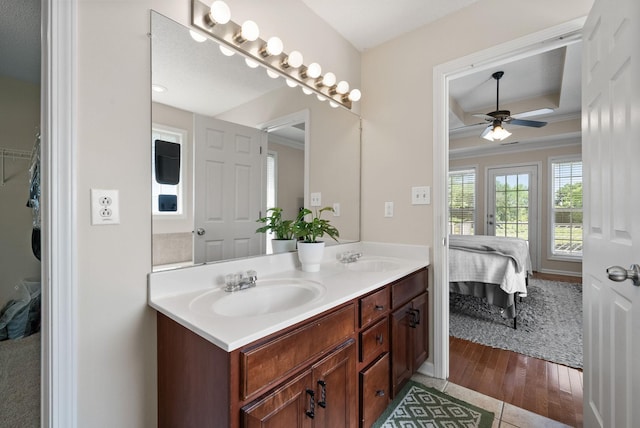 4328 Monticello Trce, Adams, TN 37010 - bathroom featuring double vanity, ensuite bathroom, ceiling fan, a tray ceiling, and ornamental molding