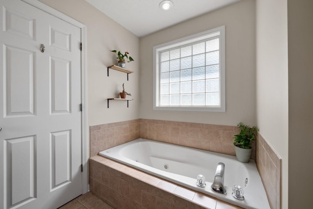 4328 Monticello Trce, Adams, TN 37010 - full bathroom with a jetted tub and tile patterned flooring