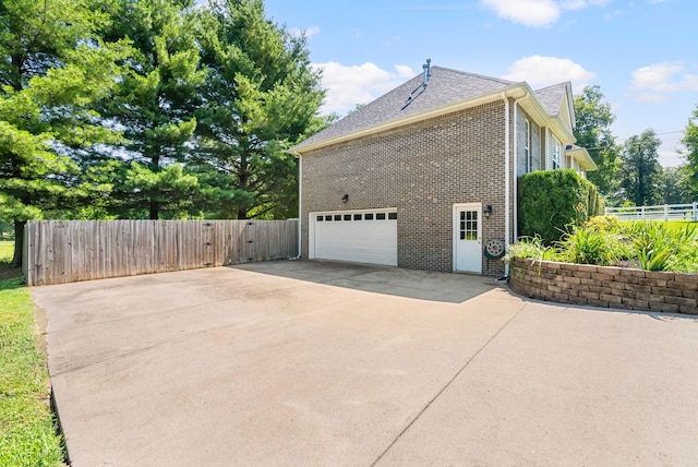 4328 Monticello Trce, Adams, TN 37010 - view of property exterior with brick siding, concrete driveway, a garage, and roof with shingles