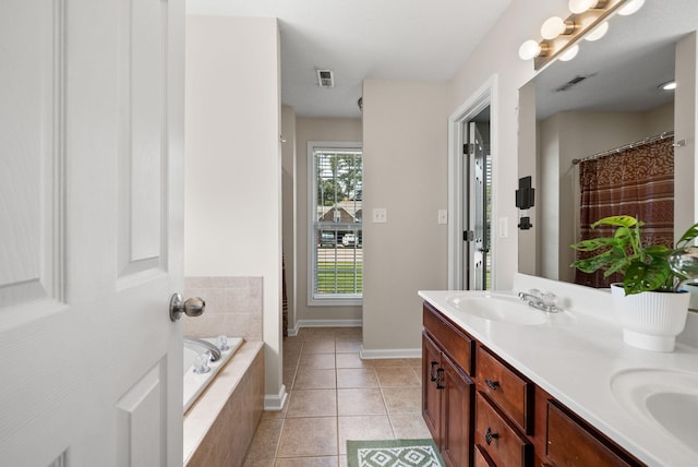 4328 Monticello Trce, Adams, TN 37010 - full bathroom featuring double vanity, a garden tub, and tile patterned flooring