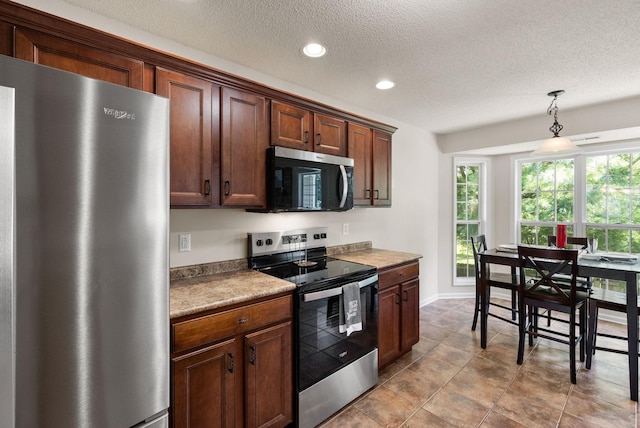 4328 Monticello Trce, Adams, TN 37010 - kitchen featuring stainless steel appliances, recessed lighting, pendant lighting, and a textured ceiling