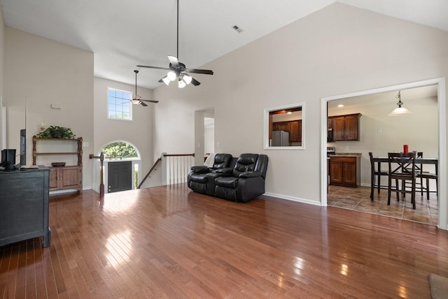 4328 Monticello Trce, Adams, TN 37010 - sitting room with an upstairs landing, high vaulted ceiling, hardwood / wood-style floors, and a ceiling fan