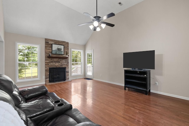 4328 Monticello Trce, Adams, TN 37010 - living area with plenty of natural light, wood finished floors, high vaulted ceiling, ceiling fan, and a stone fireplace