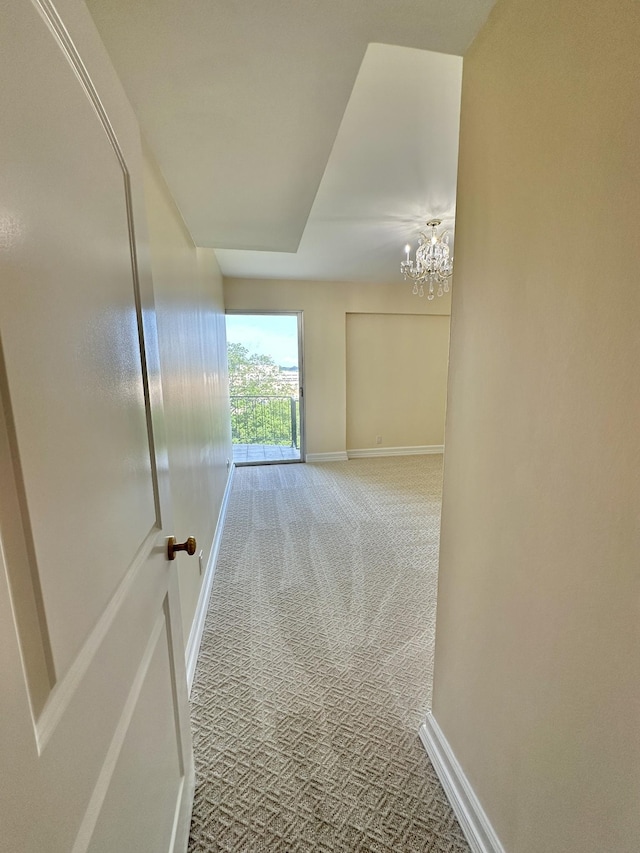 4215 Harding Pike Unit 903, Nashville, TN 37205 - hallway featuring carpet floors and a chandelier