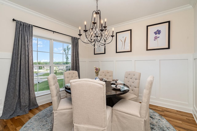3515 Shellmans Dr, Murfreesboro, TN 37129 - dining room with a chandelier, a decorative wall, crown molding, wood finished floors, and a wainscoted wall