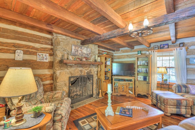 569 Hogans Branch Rd, Hendersonville, TN 37075 - living room featuring a wood ceiling with exposed beams, wood-type flooring, a stone fireplace, and a chandelier