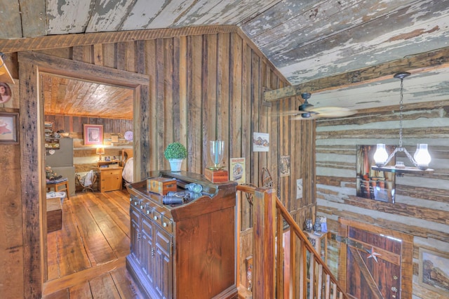 569 Hogans Branch Rd, Hendersonville, TN 37075 - corridor featuring wooden walls, lofted ceiling, hardwood / wood-style flooring, wooden ceiling, and an upstairs landing
