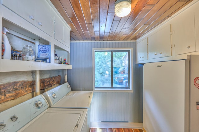 569 Hogans Branch Rd, Hendersonville, TN 37075 - washroom with separate washer and dryer, wooden ceiling, cabinet space, and wooden walls