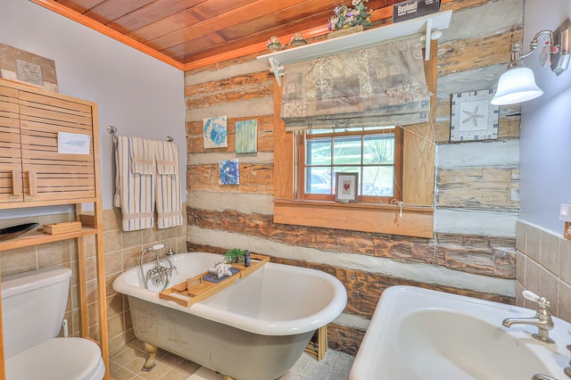 569 Hogans Branch Rd, Hendersonville, TN 37075 - bathroom with a soaking tub, wooden ceiling, and tile walls