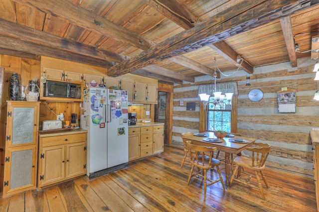 569 Hogans Branch Rd, Hendersonville, TN 37075 - kitchen featuring freestanding refrigerator, wood walls, black microwave, hardwood / wood-style flooring, and a chandelier
