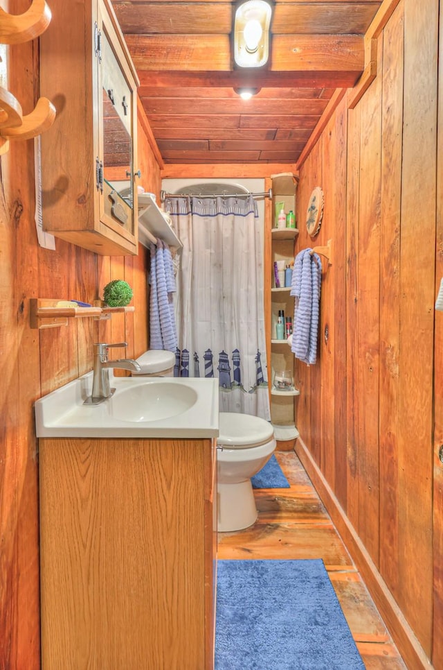 569 Hogans Branch Rd, Hendersonville, TN 37075 - full bathroom featuring vanity, wooden walls, wood ceiling, wood finished floors, and curtained shower