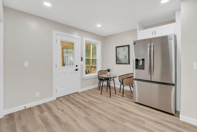 1221 Katie Ave Unit A, Nashville, TN 37207 - kitchen with stainless steel refrigerator with ice dispenser, light wood finished floors, white cabinetry, and recessed lighting