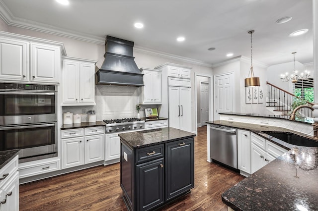 1313 Jewell Ave, Franklin, TN 37064 - kitchen with stainless steel appliances, custom range hood, white cabinets, a kitchen island, and ornamental molding