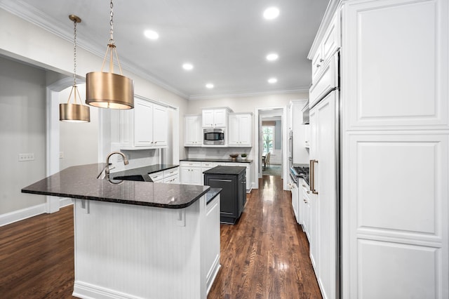 1313 Jewell Ave, Franklin, TN 37064 - kitchen with stainless steel microwave, dark wood-style floors, ornamental molding, white cabinetry, and a breakfast bar