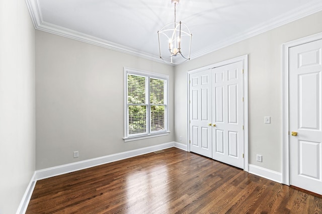 1313 Jewell Ave, Franklin, TN 37064 - unfurnished bedroom with a chandelier, dark wood-style floors, crown molding, and a closet