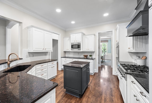 1313 Jewell Ave, Franklin, TN 37064 - kitchen with appliances with stainless steel finishes, premium range hood, white cabinetry, dark wood-style floors, and ornamental molding