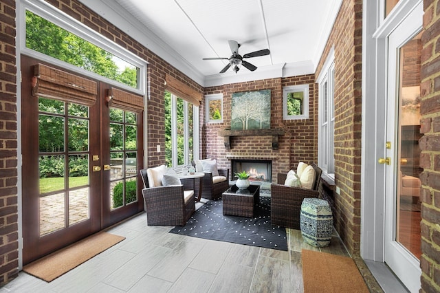 1313 Jewell Ave, Franklin, TN 37064 - sunroom / solarium with french doors, brick wall, a ceiling fan, wood finished floors, and an outdoor living space with a fireplace