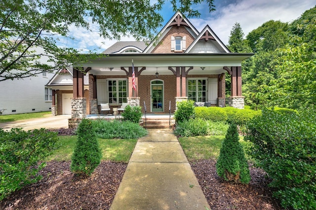 1313 Jewell Ave, Franklin, TN 37064 - craftsman-style house with brick siding, a porch, and an attached garage
