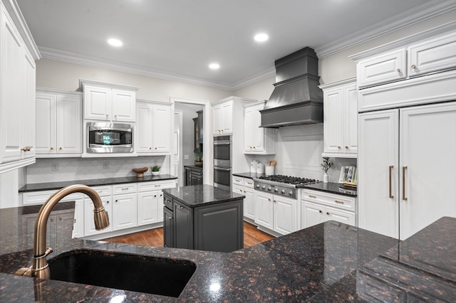 1313 Jewell Ave, Franklin, TN 37064 - kitchen with built in appliances, custom range hood, white cabinets, crown molding, and recessed lighting