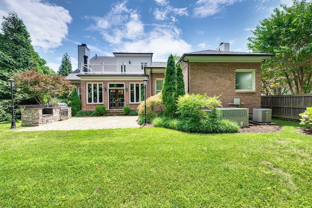 1313 Jewell Ave, Franklin, TN 37064 - rear view of property with exterior kitchen, french doors, a chimney, and brick siding
