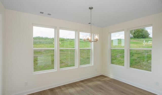 2901 Windstone Trl, Columbia, TN 38401 - unfurnished dining area with a chandelier and wood finished floors