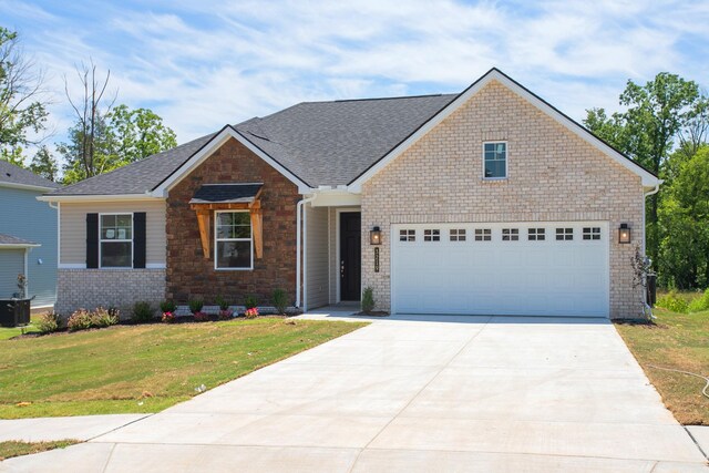 2901 Windstone Trl, Columbia, TN 38401 - view of front facade featuring driveway, a front yard, roof with shingles, and brick siding
