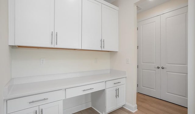 2901 Windstone Trl, Columbia, TN 38401 - kitchen featuring white cabinets, light countertops, and light wood finished floors