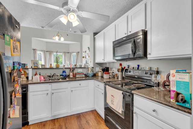1515 Bridgecrest Dr Unit 408, Antioch, TN 37013 - kitchen featuring black appliances, a textured ceiling, a ceiling fan, white cabinets, and light wood-type flooring