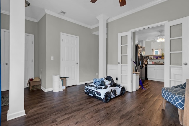 1515 Bridgecrest Dr Unit 408, Antioch, TN 37013 - bedroom featuring dark wood-type flooring, crown molding, decorative columns, ceiling fan, and black fridge with ice dispenser
