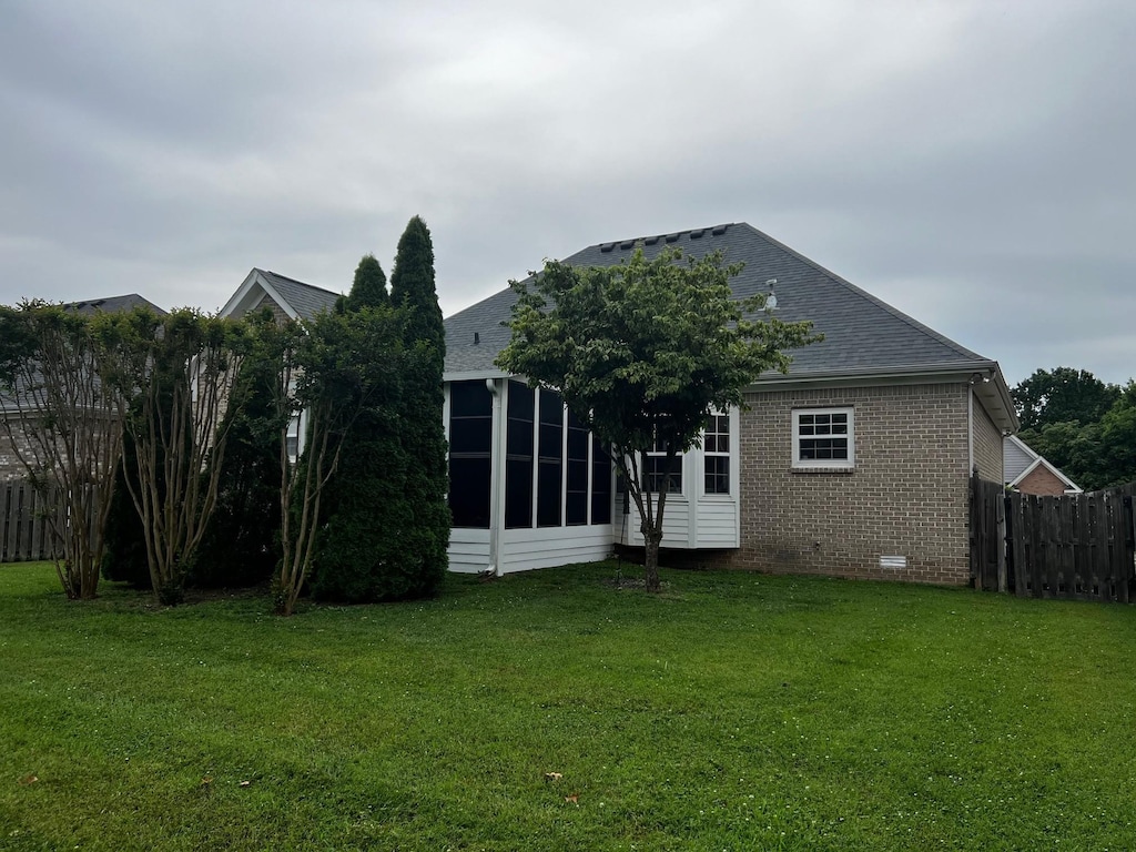 1025 Aenon Cir, Spring Hill, TN 37174 - back of house with brick siding, crawl space, a sunroom, and roof with shingles