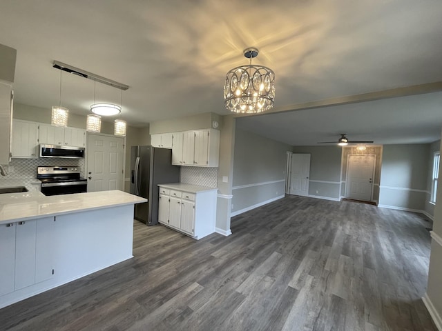 621 Buck Ln, Murfreesboro, TN 37129 - kitchen featuring stainless steel appliances, decorative backsplash, light countertops, and dark wood finished floors