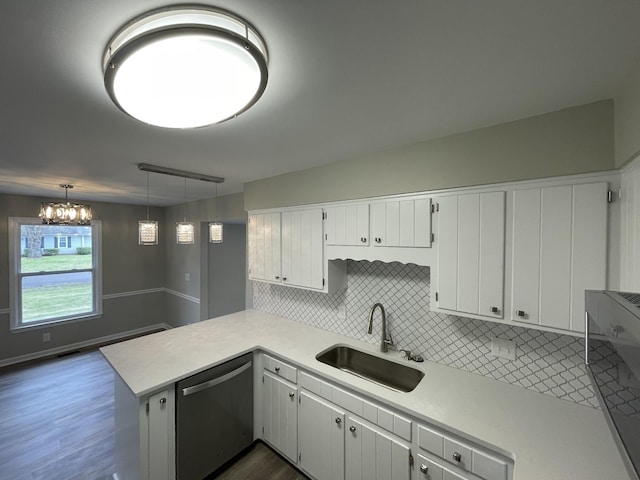 621 Buck Ln, Murfreesboro, TN 37129 - kitchen with stainless steel dishwasher, tasteful backsplash, light countertops, a peninsula, and white cabinets