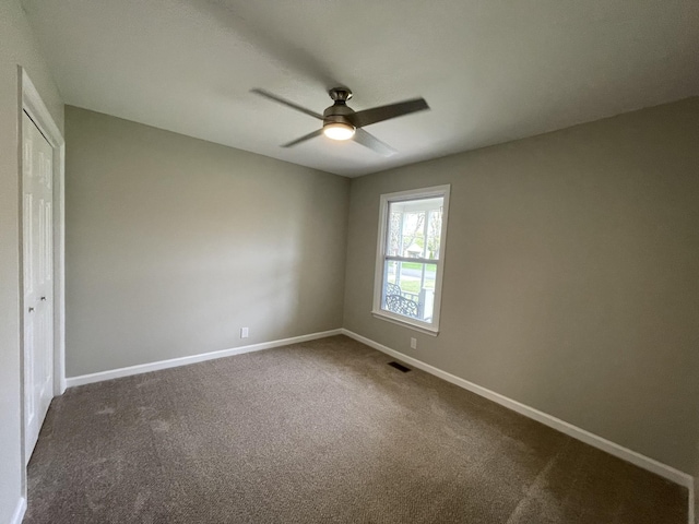 621 Buck Ln, Murfreesboro, TN 37129 - unfurnished bedroom featuring dark carpet, a closet, and ceiling fan