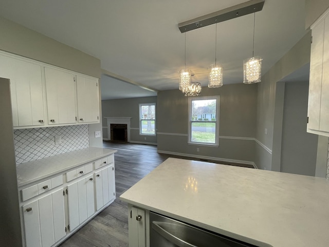 621 Buck Ln, Murfreesboro, TN 37129 - kitchen featuring wood finished floors, light countertops, a chandelier, and white cabinetry