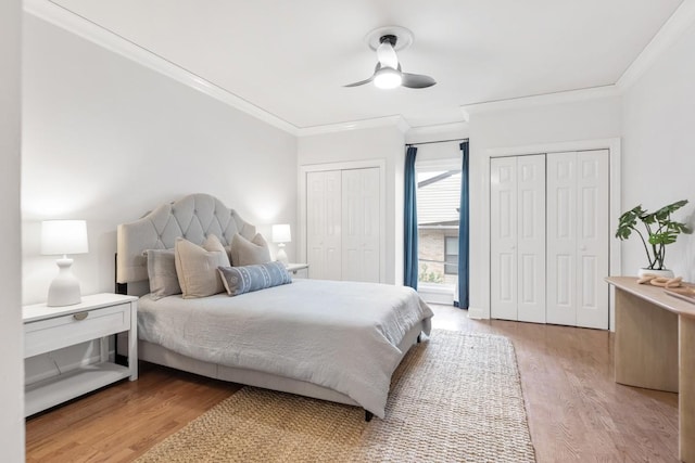 416 Sloan Rd, Nashville, TN 37209 - bedroom with crown molding, multiple closets, light wood-type flooring, and ceiling fan
