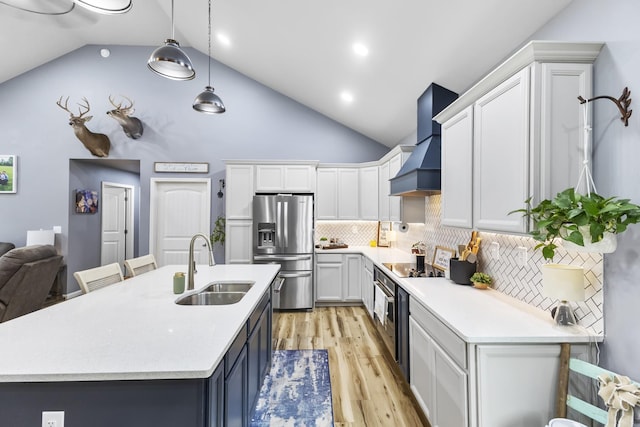 1567 Oak Knob Rd, Lafayette, TN 37083 - kitchen featuring stainless steel fridge with ice dispenser, wall chimney exhaust hood, light countertops, light wood-style floors, and high vaulted ceiling