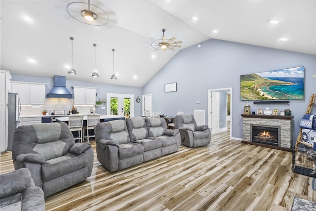 1567 Oak Knob Rd, Lafayette, TN 37083 - living area featuring high vaulted ceiling, a ceiling fan, light wood-style flooring, a fireplace, and recessed lighting