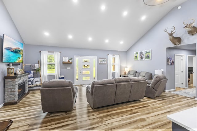 1567 Oak Knob Rd, Lafayette, TN 37083 - living area with high vaulted ceiling, light wood finished floors, recessed lighting, and a stone fireplace
