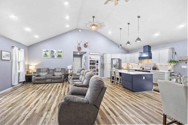 1567 Oak Knob Rd, Lafayette, TN 37083 - living area featuring light wood-style flooring, a ceiling fan, high vaulted ceiling, and recessed lighting