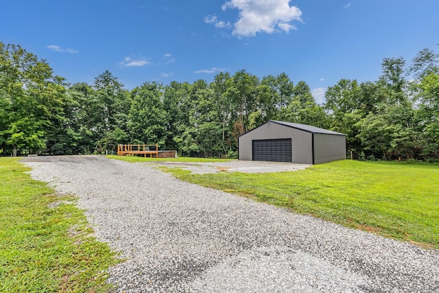 1567 Oak Knob Rd, Lafayette, TN 37083 - detached garage featuring a view of trees