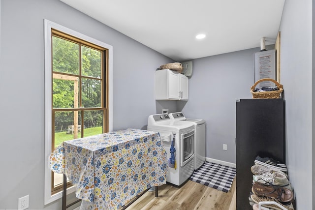 1567 Oak Knob Rd, Lafayette, TN 37083 - laundry room with cabinet space, washing machine and clothes dryer, light wood-style floors, and recessed lighting
