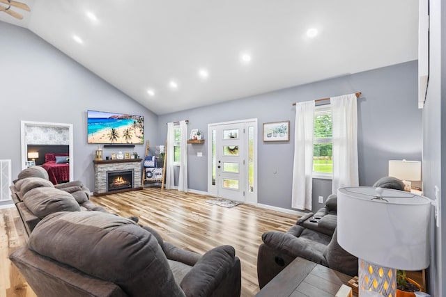 1567 Oak Knob Rd, Lafayette, TN 37083 - living room featuring wood finished floors, recessed lighting, high vaulted ceiling, and a stone fireplace
