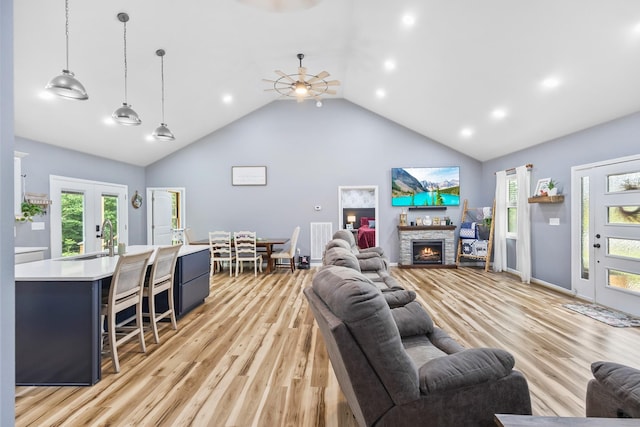 1567 Oak Knob Rd, Lafayette, TN 37083 - living room featuring a ceiling fan, high vaulted ceiling, light wood-style floors, a fireplace, and recessed lighting