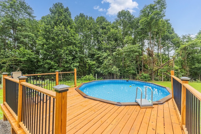 1567 Oak Knob Rd, Lafayette, TN 37083 - swimming pool featuring a wooden deck and view of wooded area